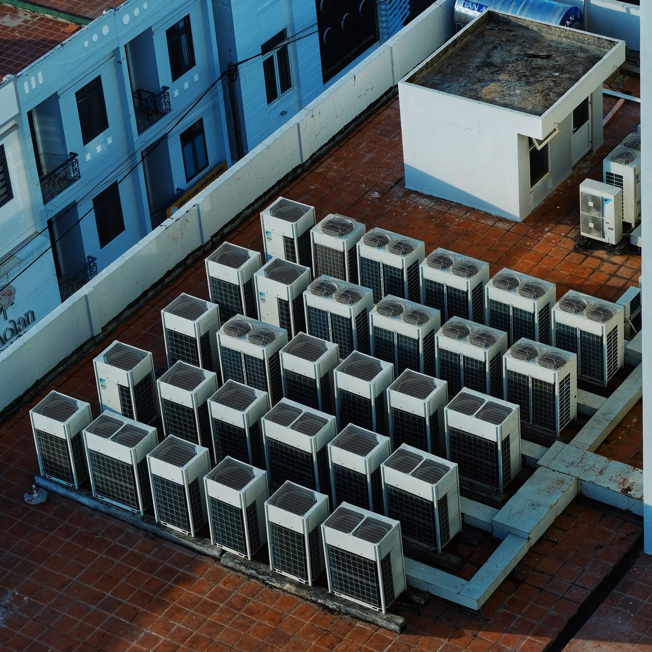 High angle view of rooftop HVAC units on a building.